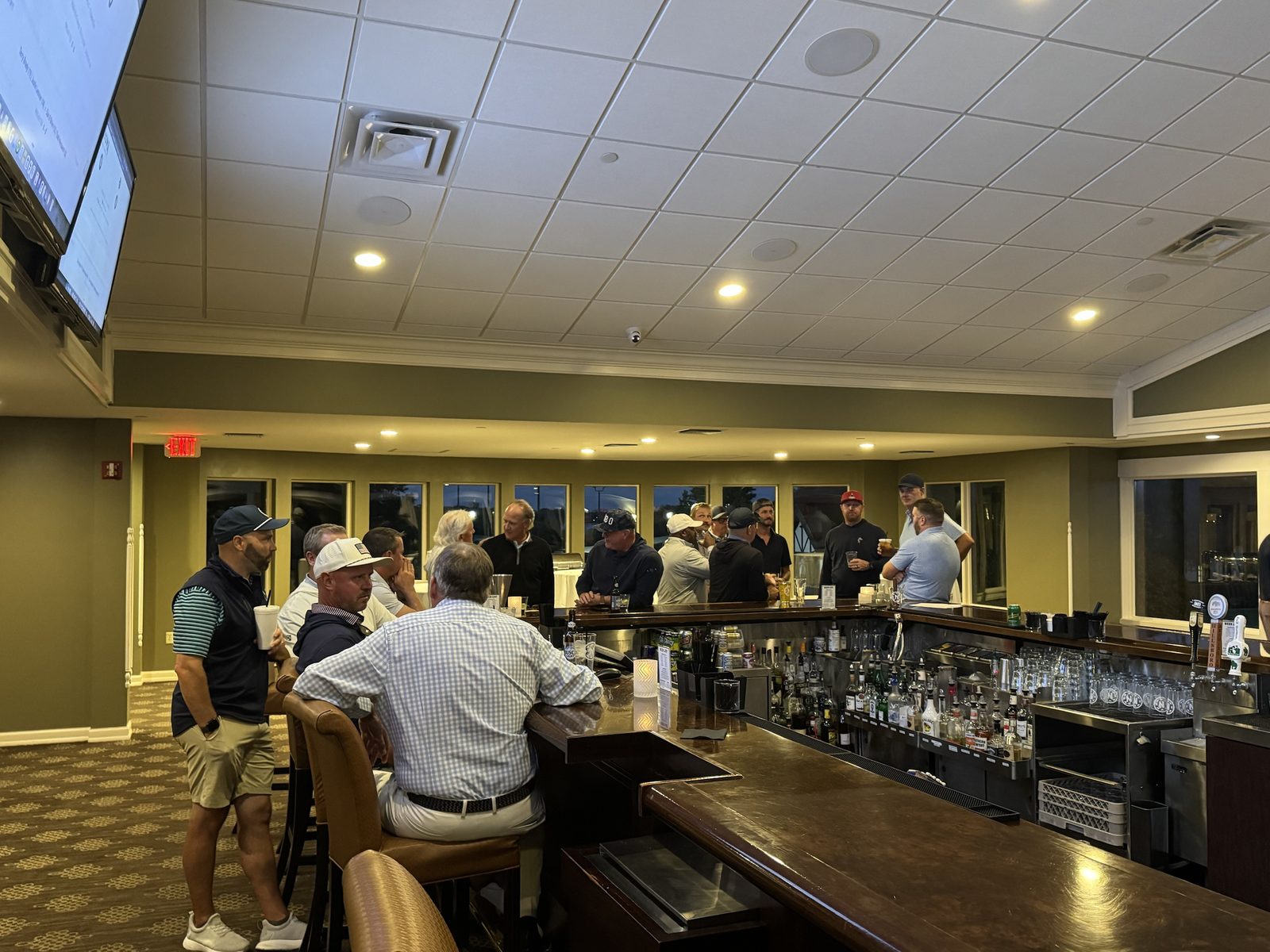 Players gathered at the clubhouse bar the night before