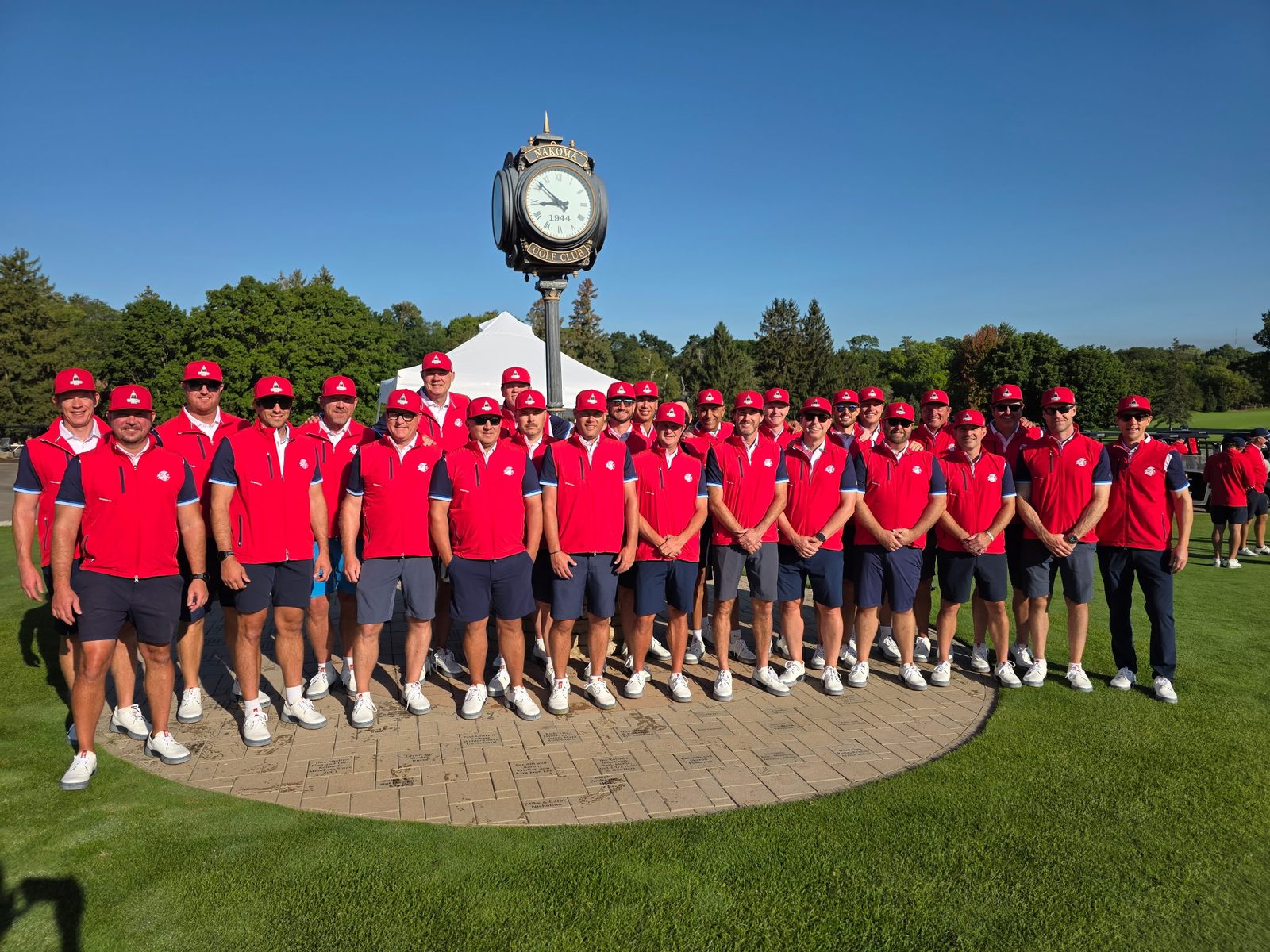 Team Nakoma posed at the Nakoma Golf Club clock