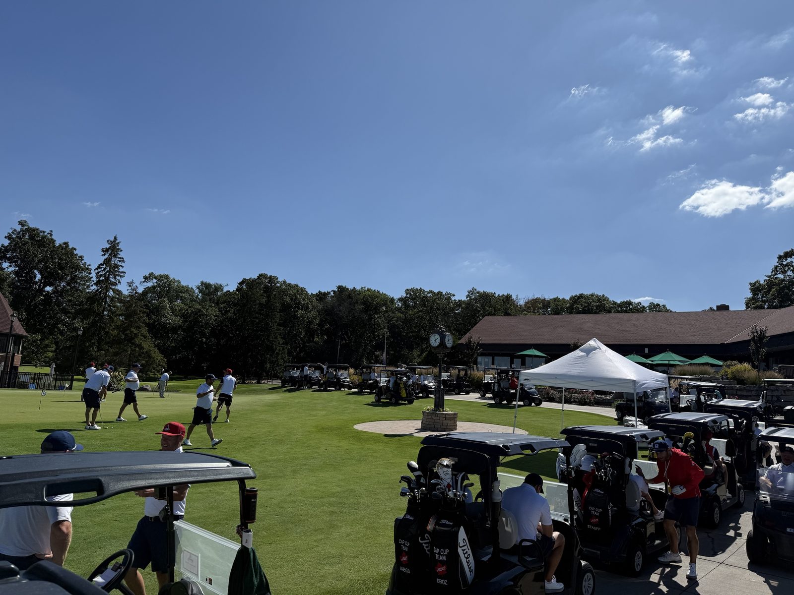 Players warming up on the putting green