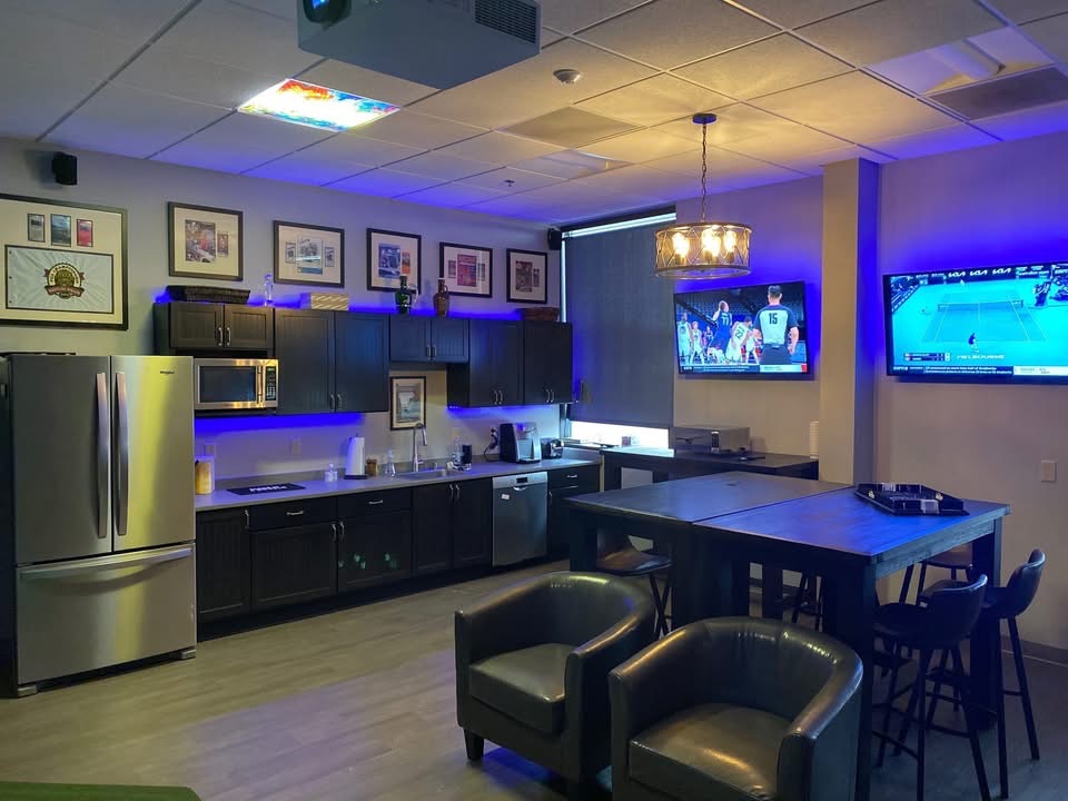 The Deming Pub wall sign next to the simulator screen